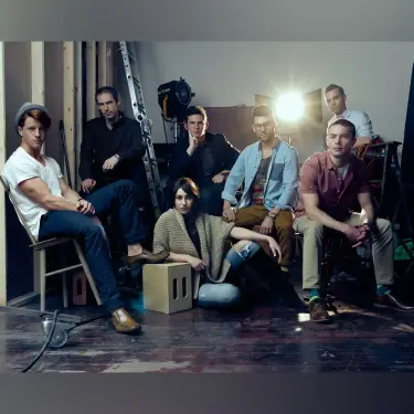 Professional ensemble cast portrait of The Chicago 7 theater company in casual-smart attire arranged in collaborative group pose within studio setting, image by Chicago, IL portrait photographer 312 Elements Headshot Photography