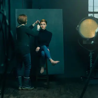 Behind-the-scenes styling session with Emily Debour, relationship coach, being prepared in professional studio with lighting equipment visible, photo by 312 Elements Headshot Photography, Chicago, IL photographer