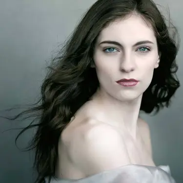 Lauren Dod ethereal beauty headshot with long dark wavy hair and serene expression against soft neutral studio backdrop, captured by 312 Elements Headshot Photography, headshot photographer in Chicago, IL