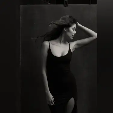 Black and white professional portrait of woman with dark hair in tank top against dark background studio setting, portrait photographer 312 Elements Headshot Photography | Chicago, IL