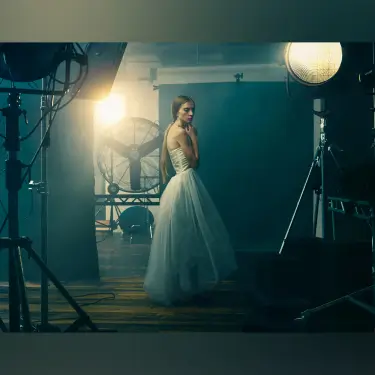 Ethereal portrait of woman in flowing white tulle dress against dark teal background with dramatic studio lighting, portrait photographer 312 Elements Headshot Photography | Chicago, IL