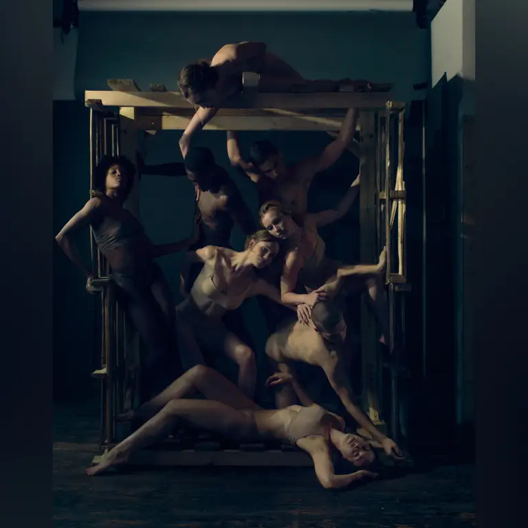 Artistic composite studio portrait of Visceral Dance Company with multiple figures in theatrical poses within geometric structure and dramatic lighting, captured by 312 Elements Headshot Photography, photographer in Chicago, IL