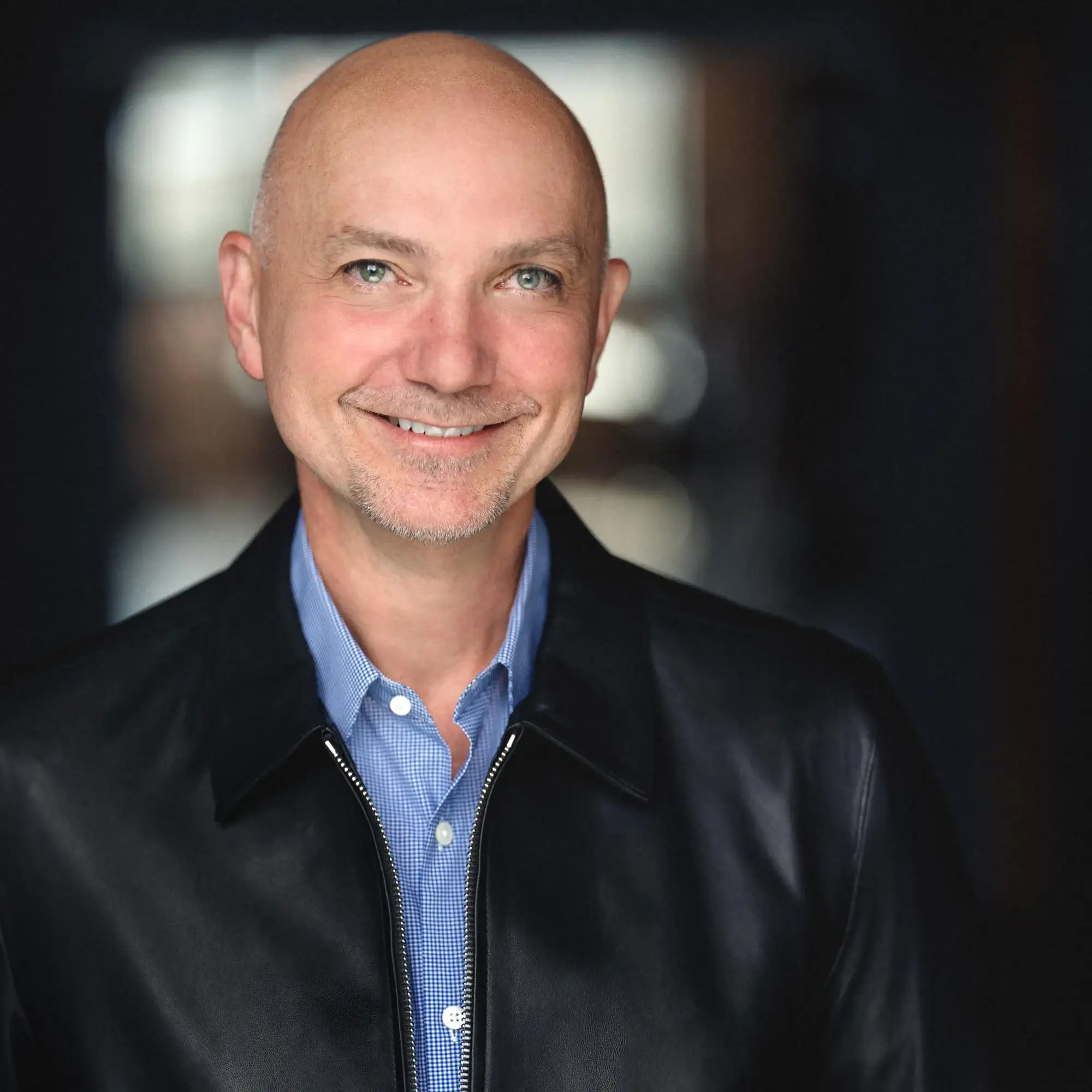 Premium Actor headshot of a man in a leather jacket, showcasing a confident expression, ideal for casting calls and promotional materials